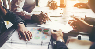 Group of business professionals reviewing receivership paperwork